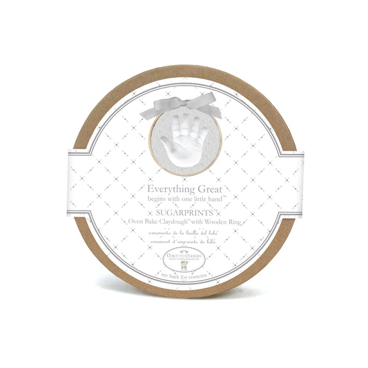 Round brown cardboard box labeled Sugarprints oven bake clay handprint kit with image of handprint on front