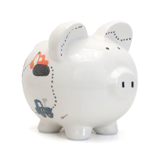 Side view of handpainted ceramic piggy bank with colorful construction vehicles