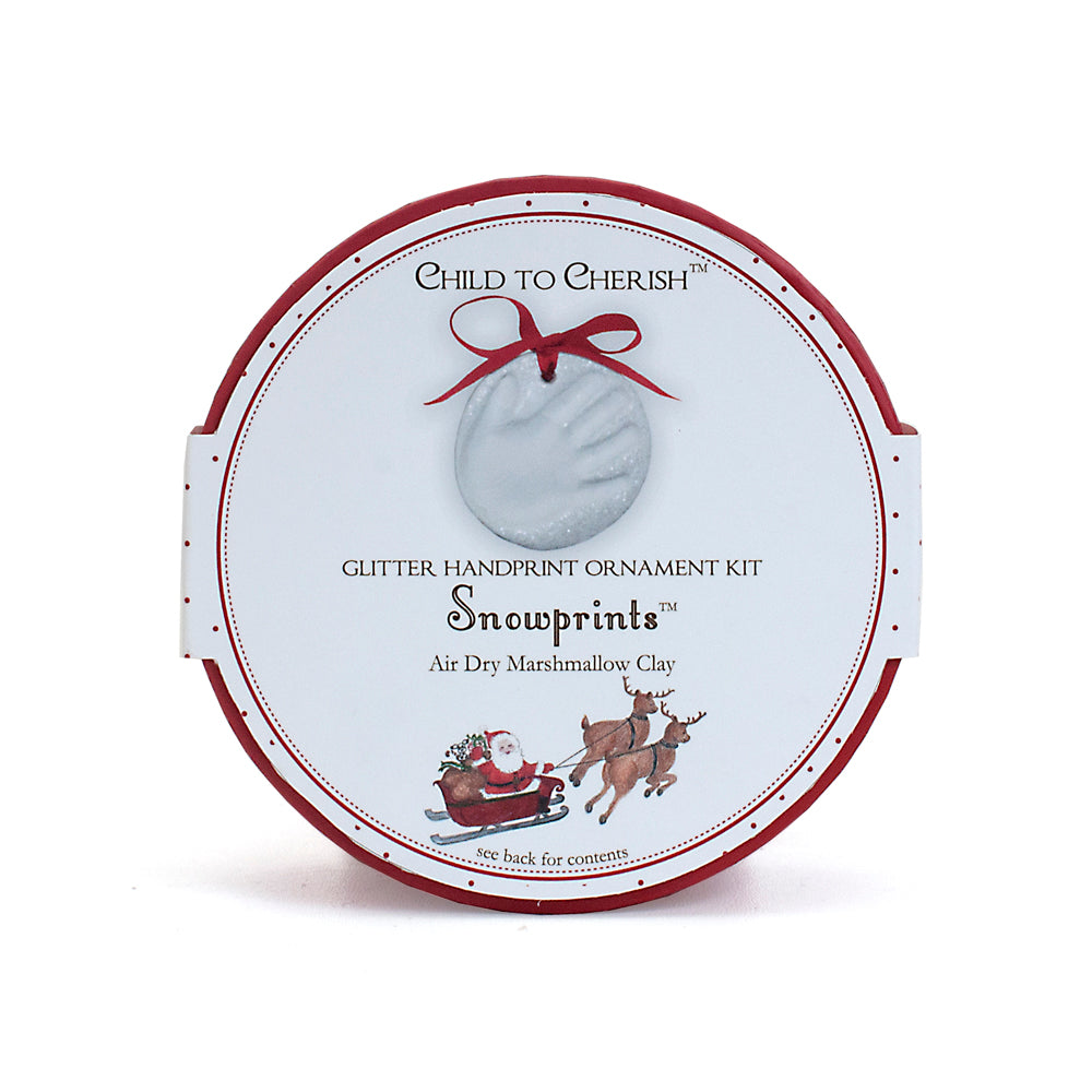 Round Snowprints Glitter Handprint Ornament Kit box with holiday design and Santa sleigh illustration