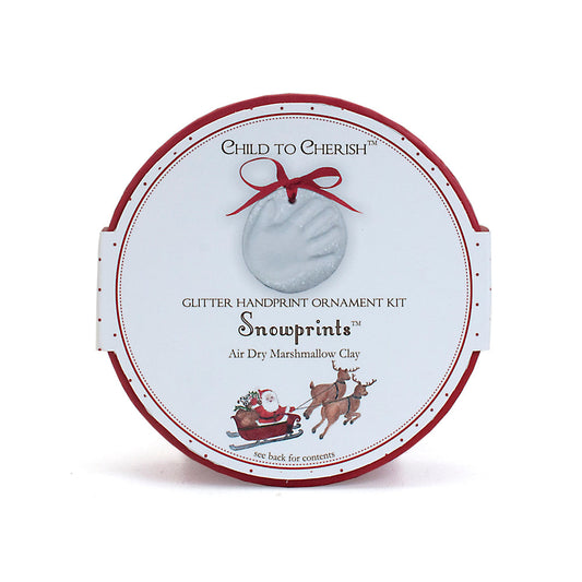 Round Snowprints Glitter Handprint Ornament Kit box with holiday design and Santa sleigh illustration