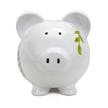 Back view of ceramic piggy bank with handpainted monkey holding leaf