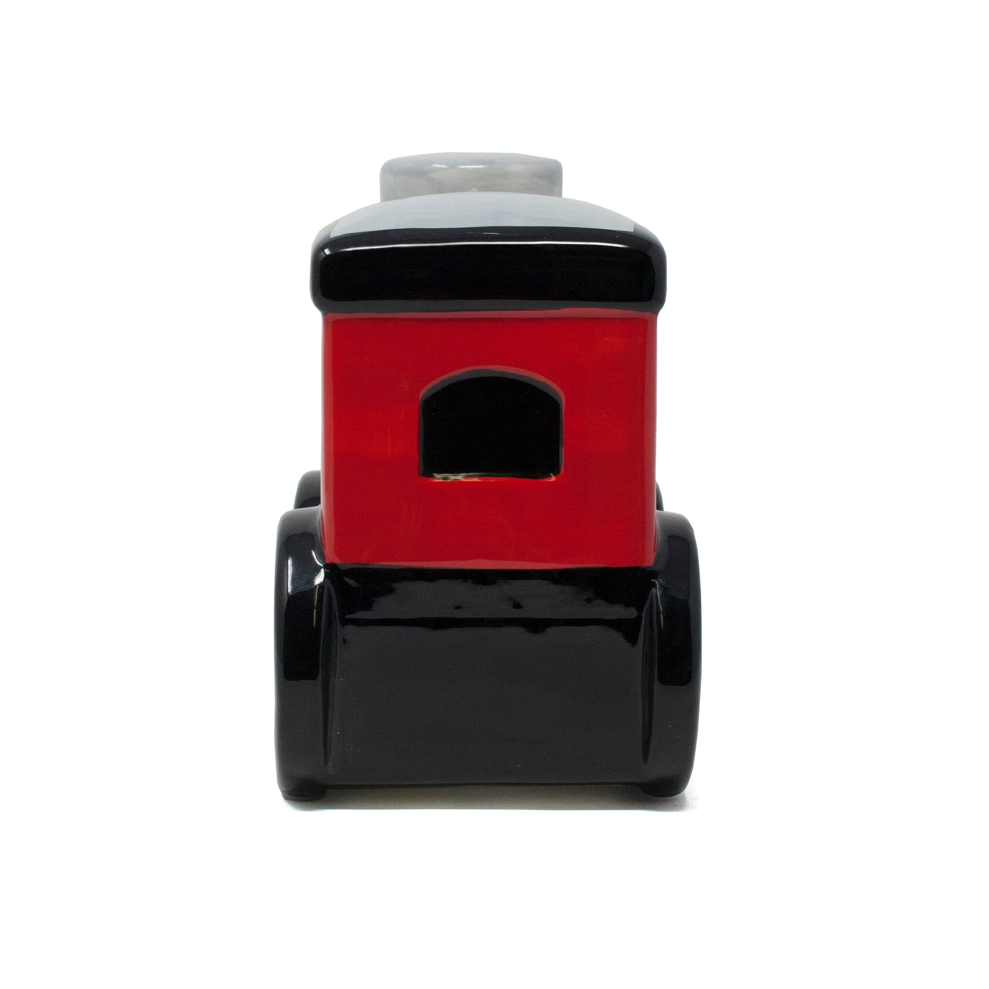 Back view of red ceramic train money bank showing rear window and base