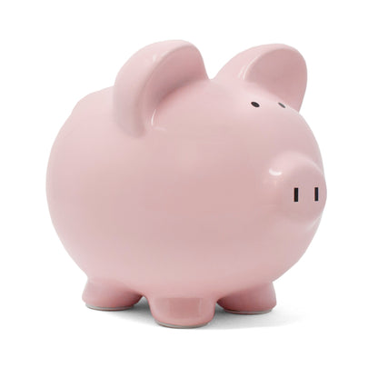 Pink ceramic piggy bank angled left view on white background
