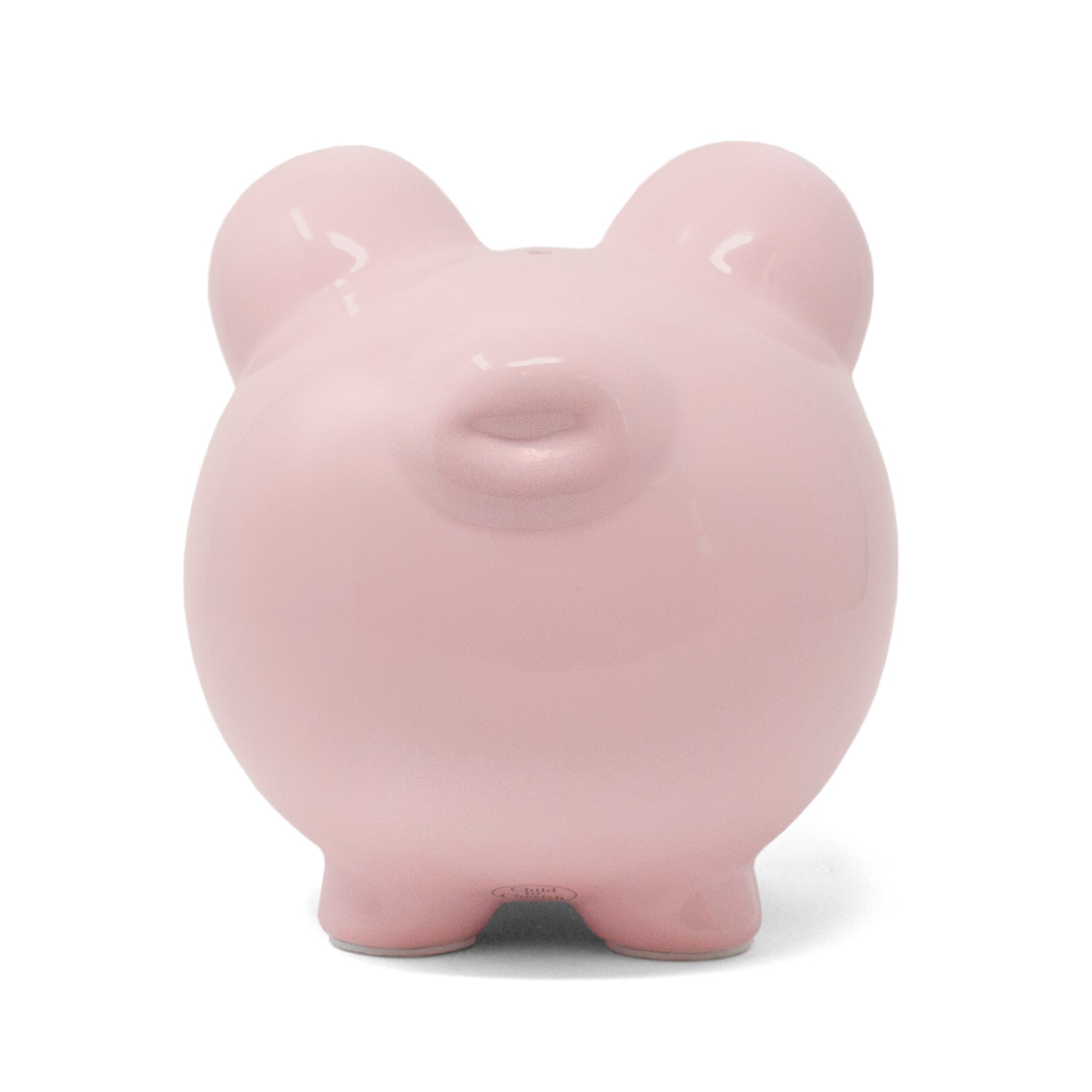Back view of pink ceramic piggy bank showing simple rounded shape