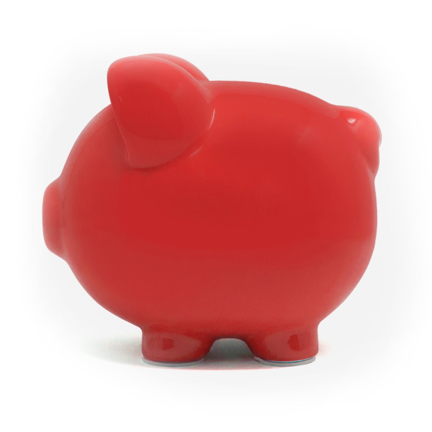 Side profile of a smooth red ceramic piggy bank displaying rounded ear and leg shapes