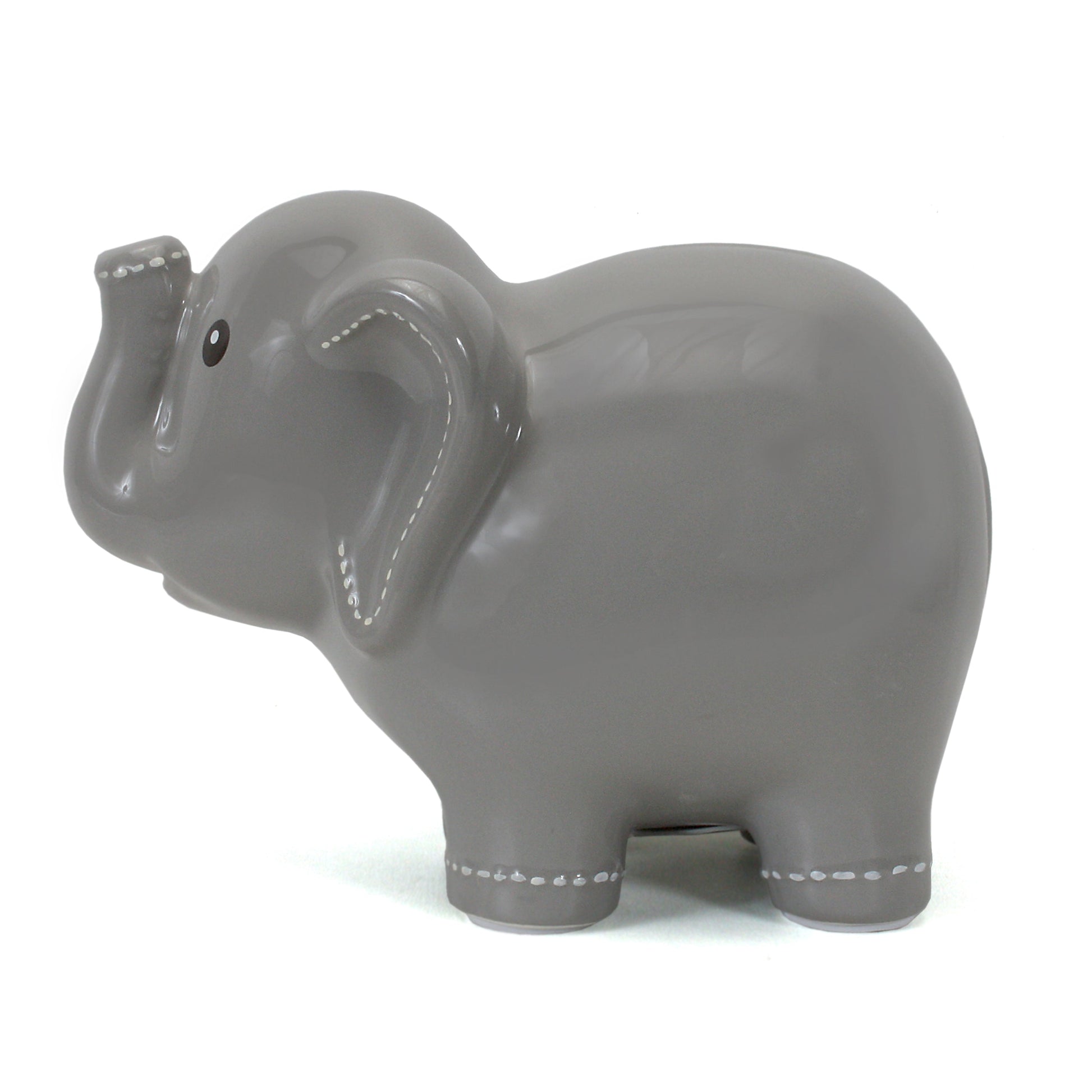 Side view of large ceramic elephant bank highlighting smooth finish and white handpainted stitching