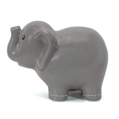 Side view of large ceramic elephant bank highlighting smooth finish and white handpainted stitching