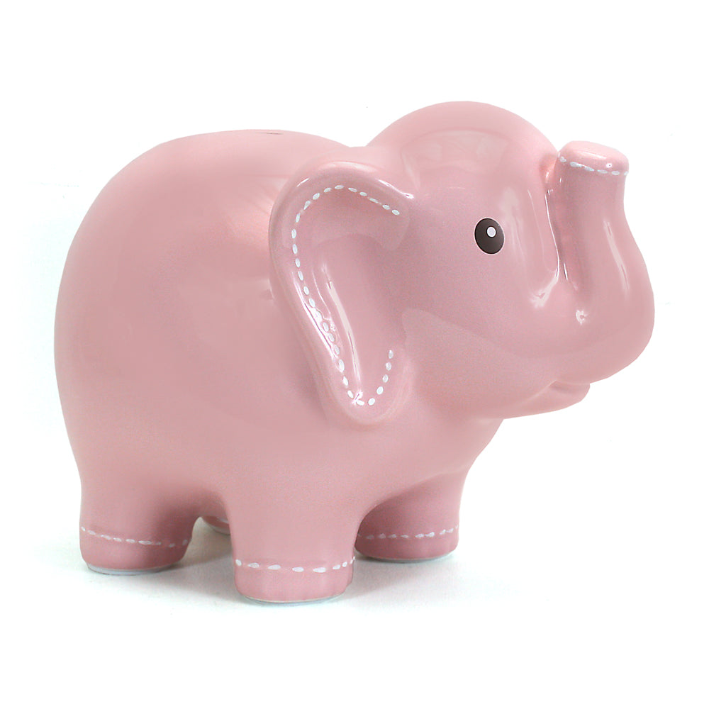 Front left side view of large pink ceramic elephant coin bank with handpainted white stitch details