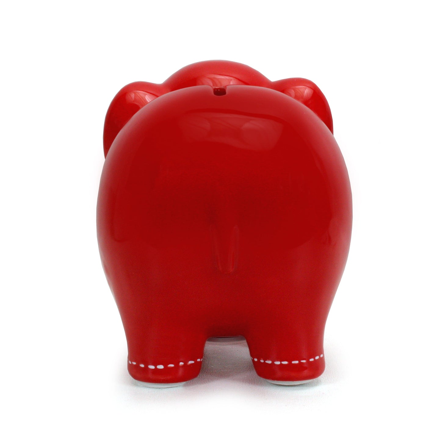 Back view of large red elephant piggy bank showing smooth glossy finish and coin stopper
