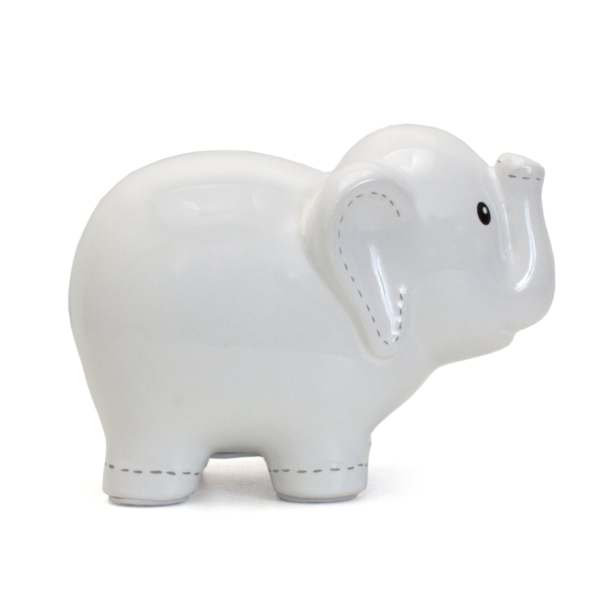 Right side view of white elephant piggy bank highlighting smooth ceramic surface