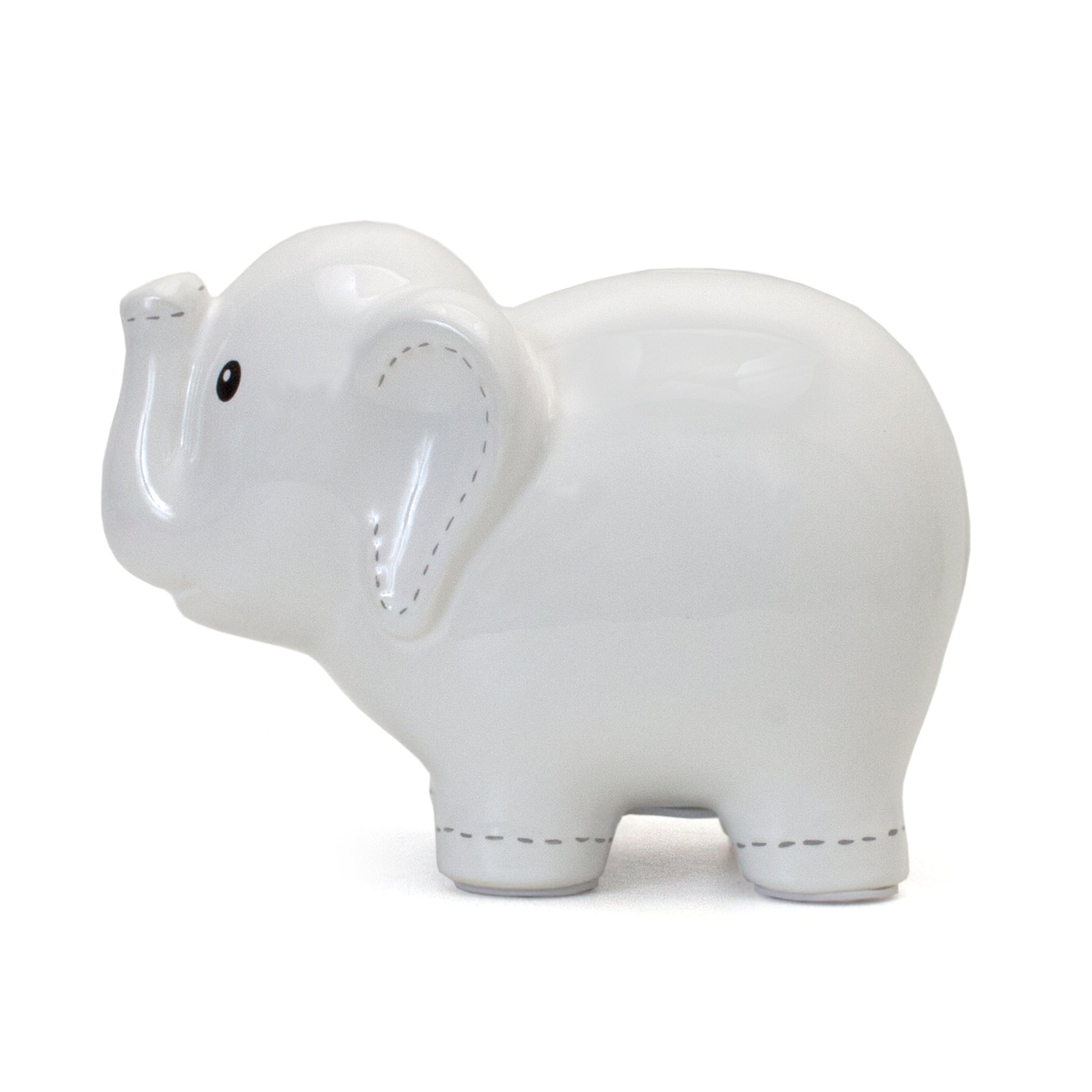 Close-up of white stitched elephant bank with coin slot on top