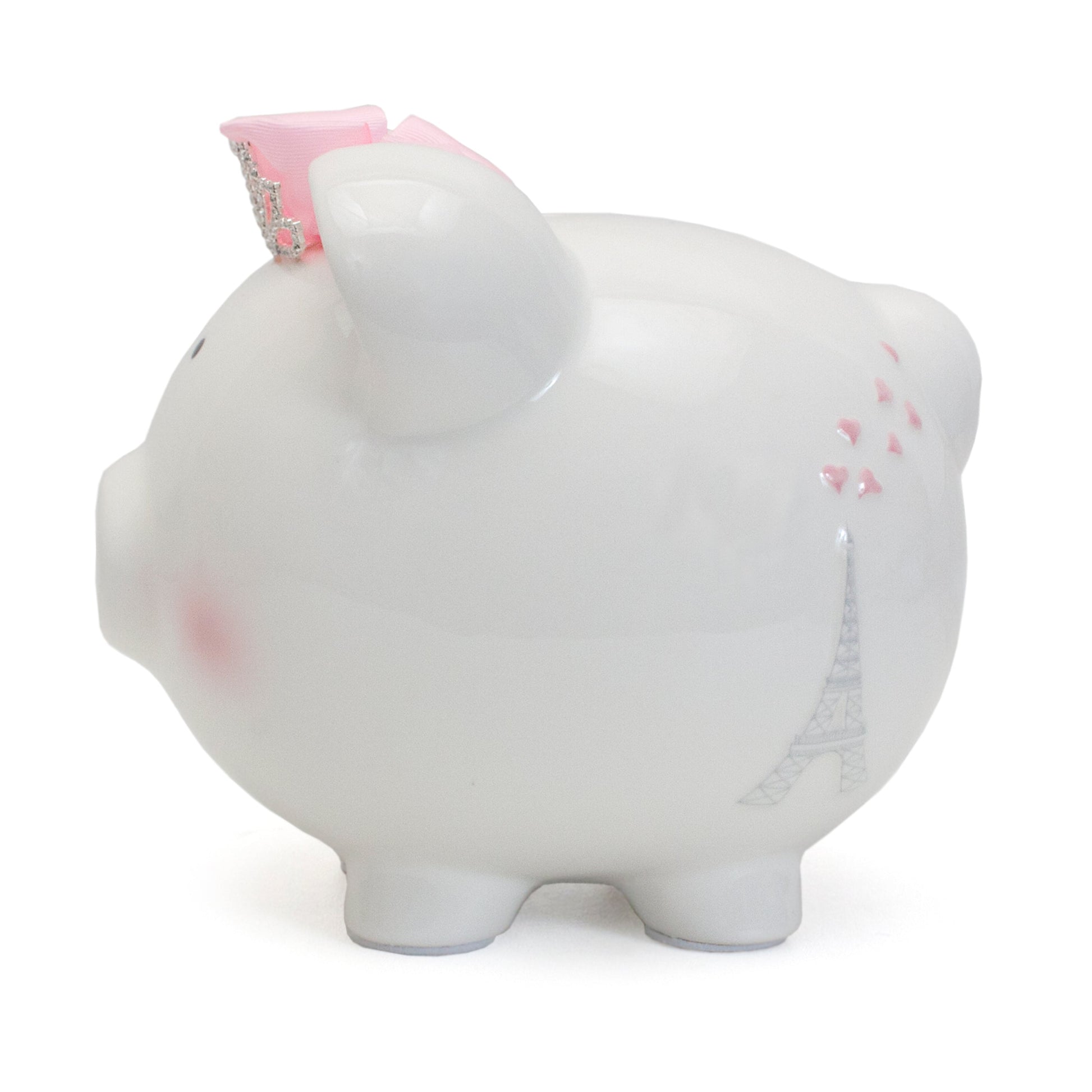 Other side of white ceramic piggy bank showing the Eiffel Tower and small pink hearts with a pink bow on top