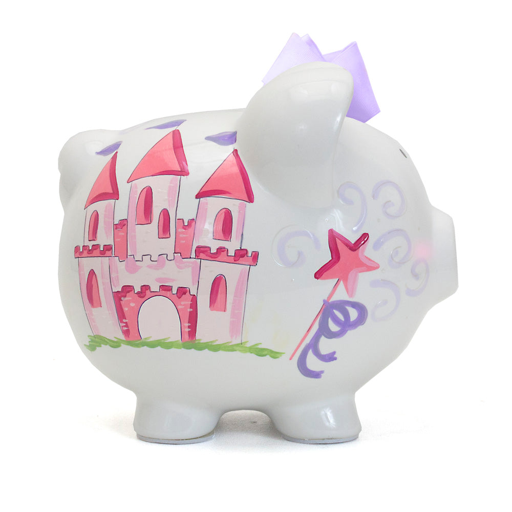 Side view of white ceramic piggy bank with pink castle and lavender bow