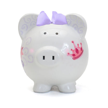 Front view of piggy bank featuring pig face with purple swirls, pink crown, and lavender bow