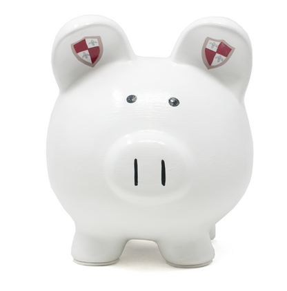 Front view of white piggy bank with simple black eyes and red shield symbols painted on ears
