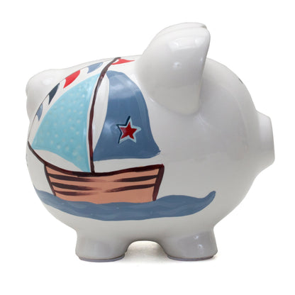 Side view showing nautical sailboat design in soft colors on piggy bank