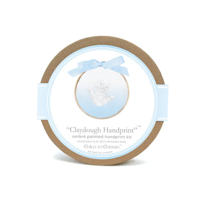 Ombre blue handprint kit packaging with wooden ring and blue ribbon