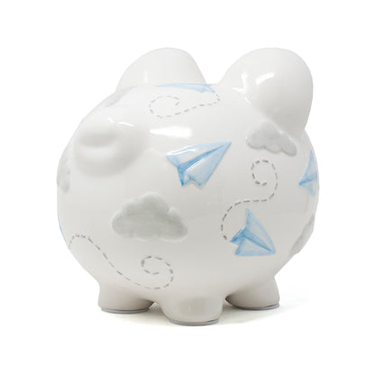 Left side view of piggy bank highlighting handpainted blue paper airplanes and gray clouds