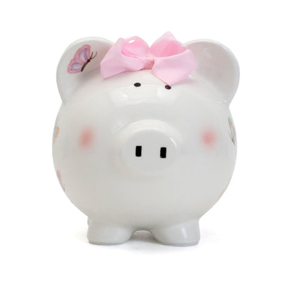 Back view of ceramic piggy bank showing butterfly patterns and smooth glossy finish