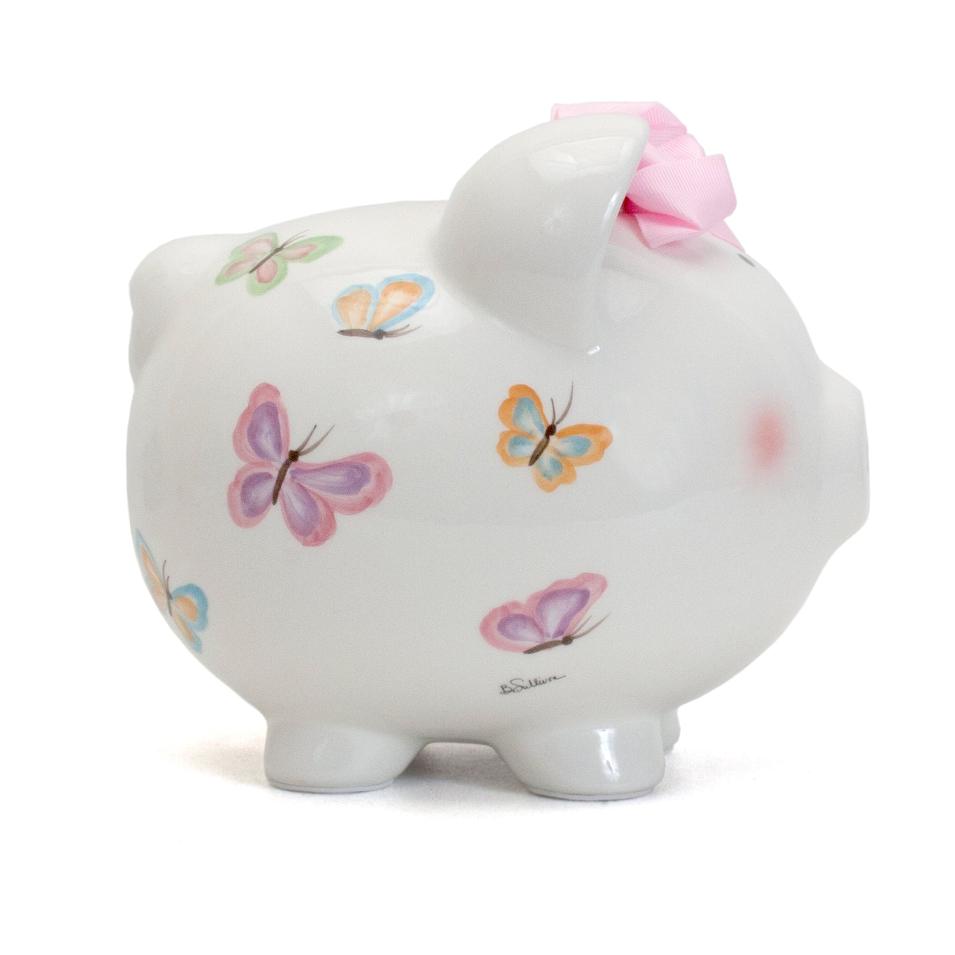Side view showing pastel handpainted butterflies on white ceramic piggy bank with pink bow
