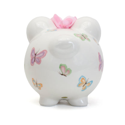 Top view of piggy bank showing coin slot behind the pink bow between ears