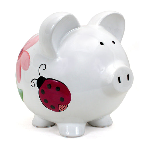 Large white ceramic piggy bank with handpainted ladybug and pink flower on side