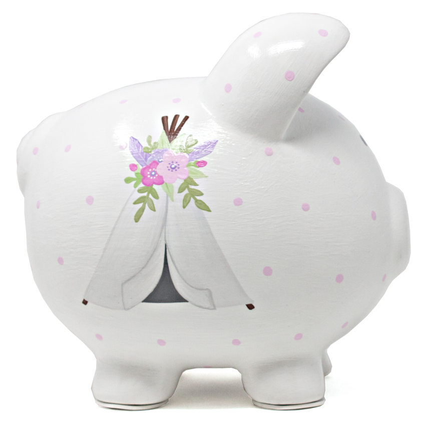 Right side of white ceramic piggy bank featuring a handpainted bohemian style teepee with floral accents