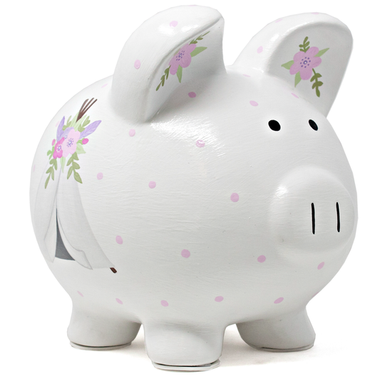 White ceramic piggy bank with pink polka dots and handpainted floral designs viewed from front right side