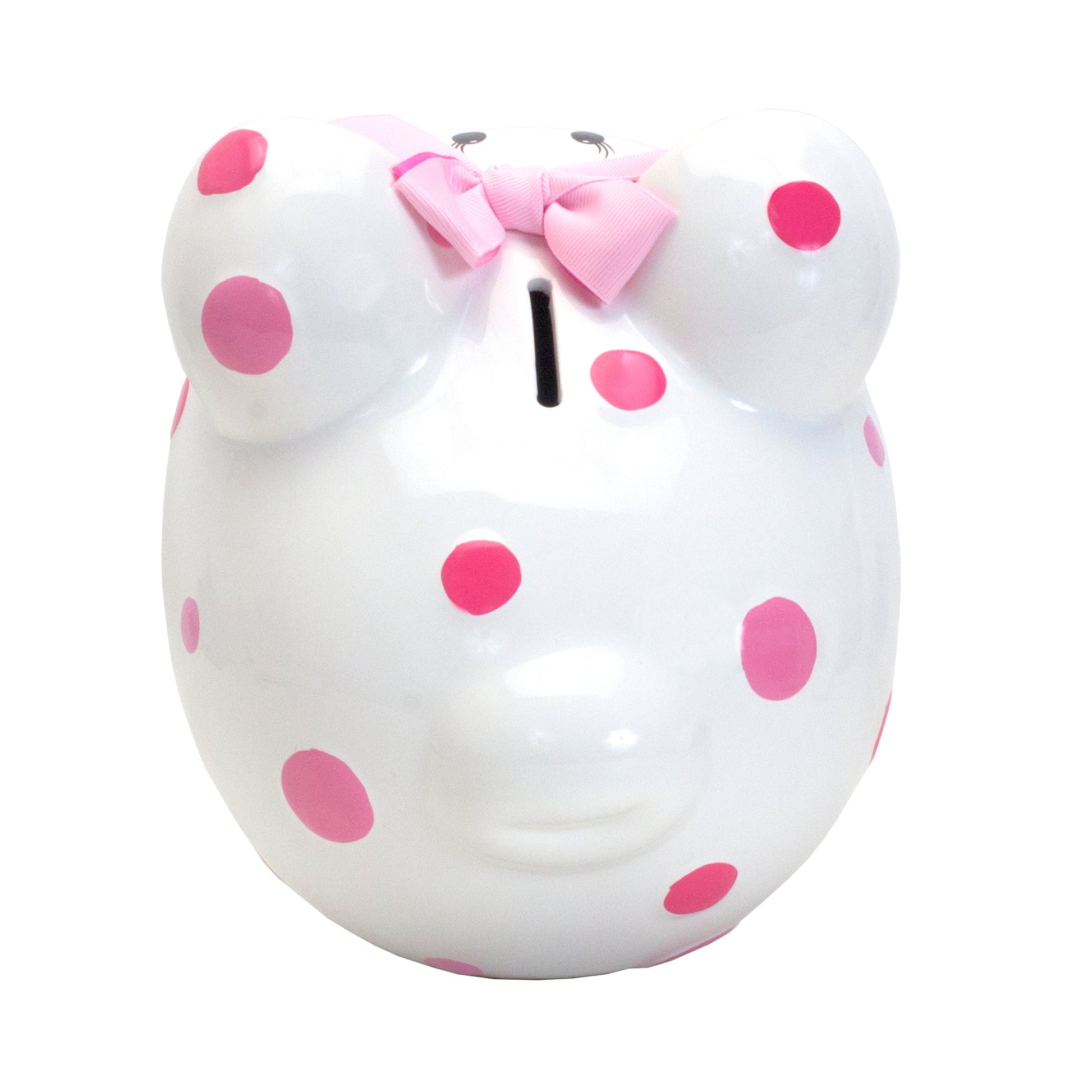 Close-up of piggy bank face with black eyes, eyelashes, pink polka dots and pink ribbon bow