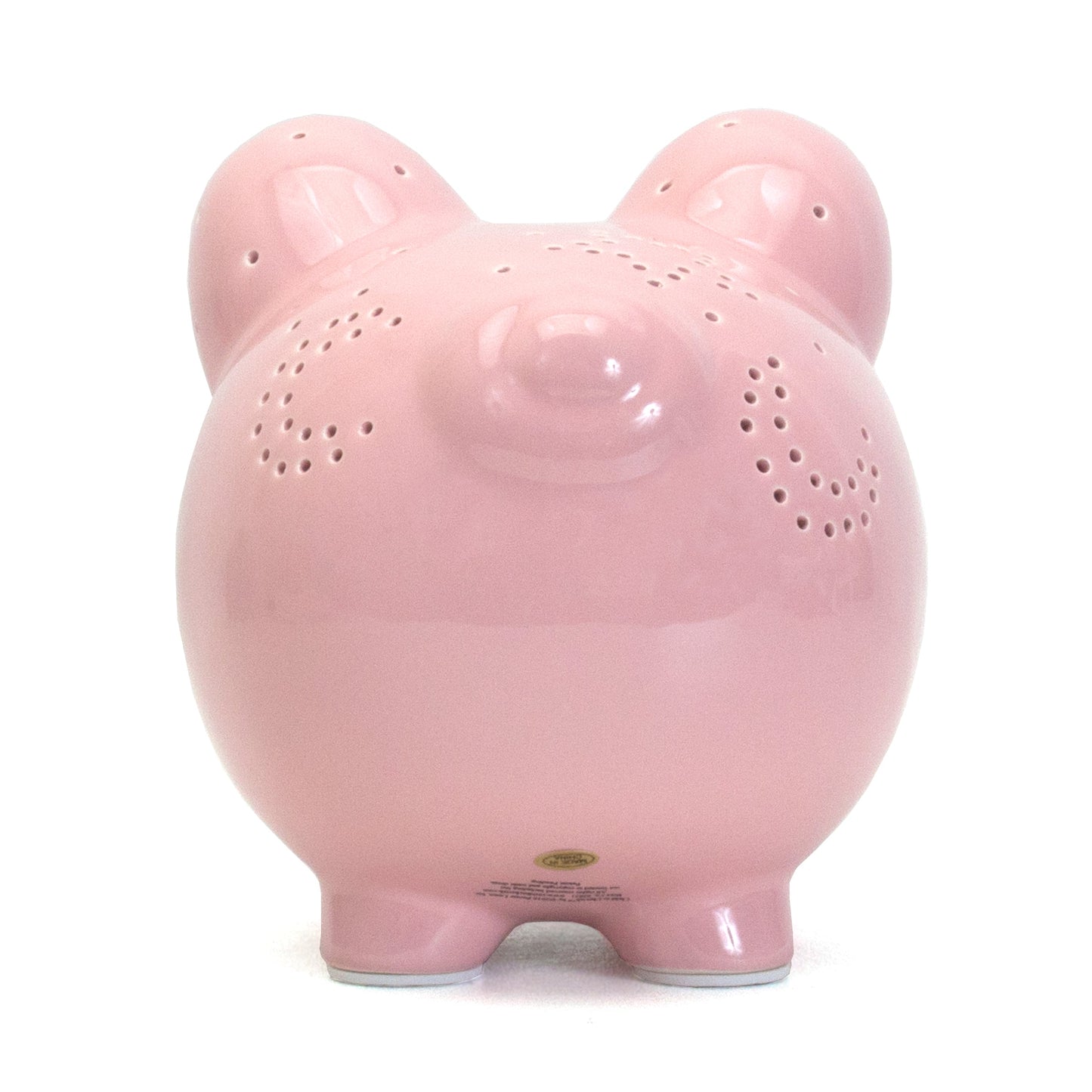 Front view of pink piggy bank with closed eye design and star details