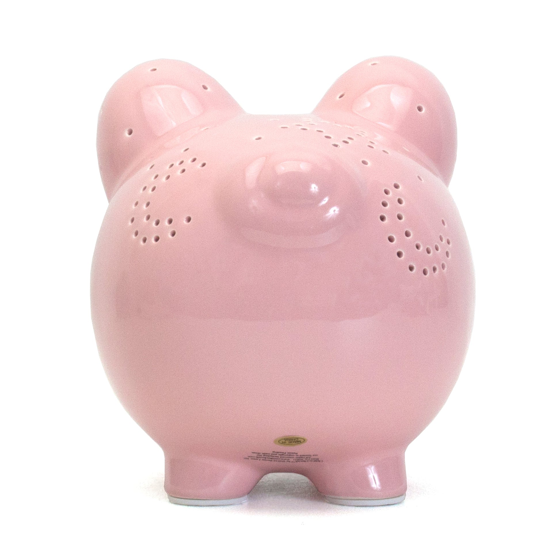 Front view of pink piggy bank with closed eye design and star details