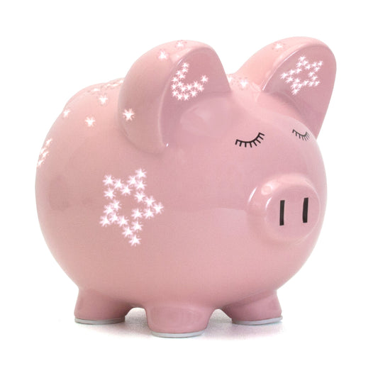 Pink piggy bank with handpainted sleepy eyes and glowing star night light effect