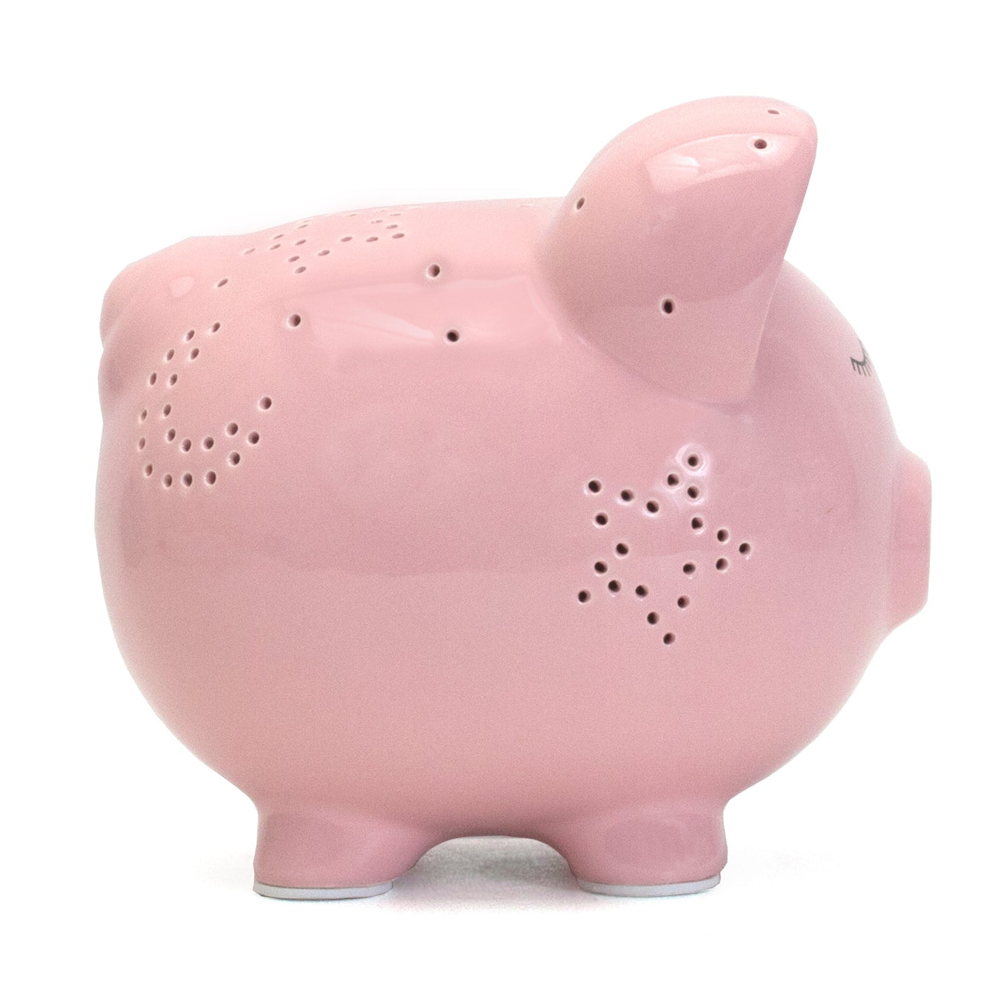 Back view of pink piggy bank with star-shaped holes for night light