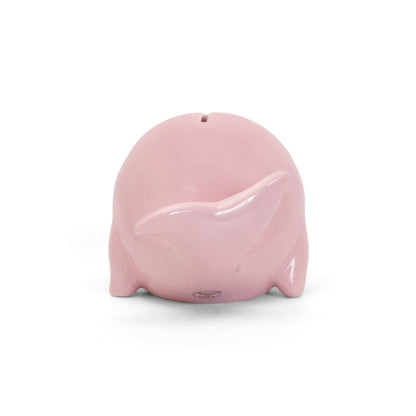 Rear view of pink whale piggy bank highlighting coin slot on back