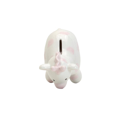 Top view showing coin slot on pink spotted ceramic giraffe piggy bank