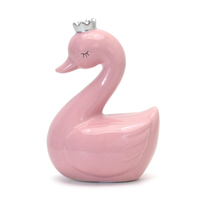 Close-up front view of pink swan piggy bank with silver crown