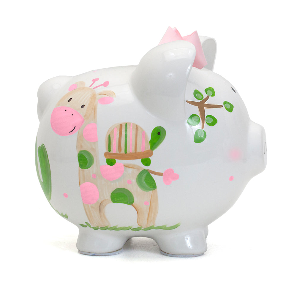 Side view of Pink Tropical Punch Piggy bank with giraffe and turtle painted on white ceramic