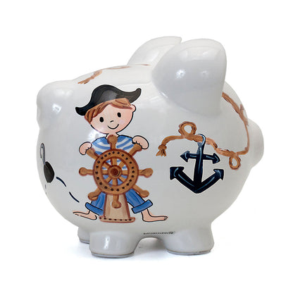 Side angle of ceramic piggy bank featuring pirate boy and nautical elements