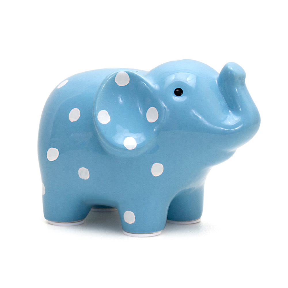 Blue ceramic elephant piggy bank with white polka dots on a white background
