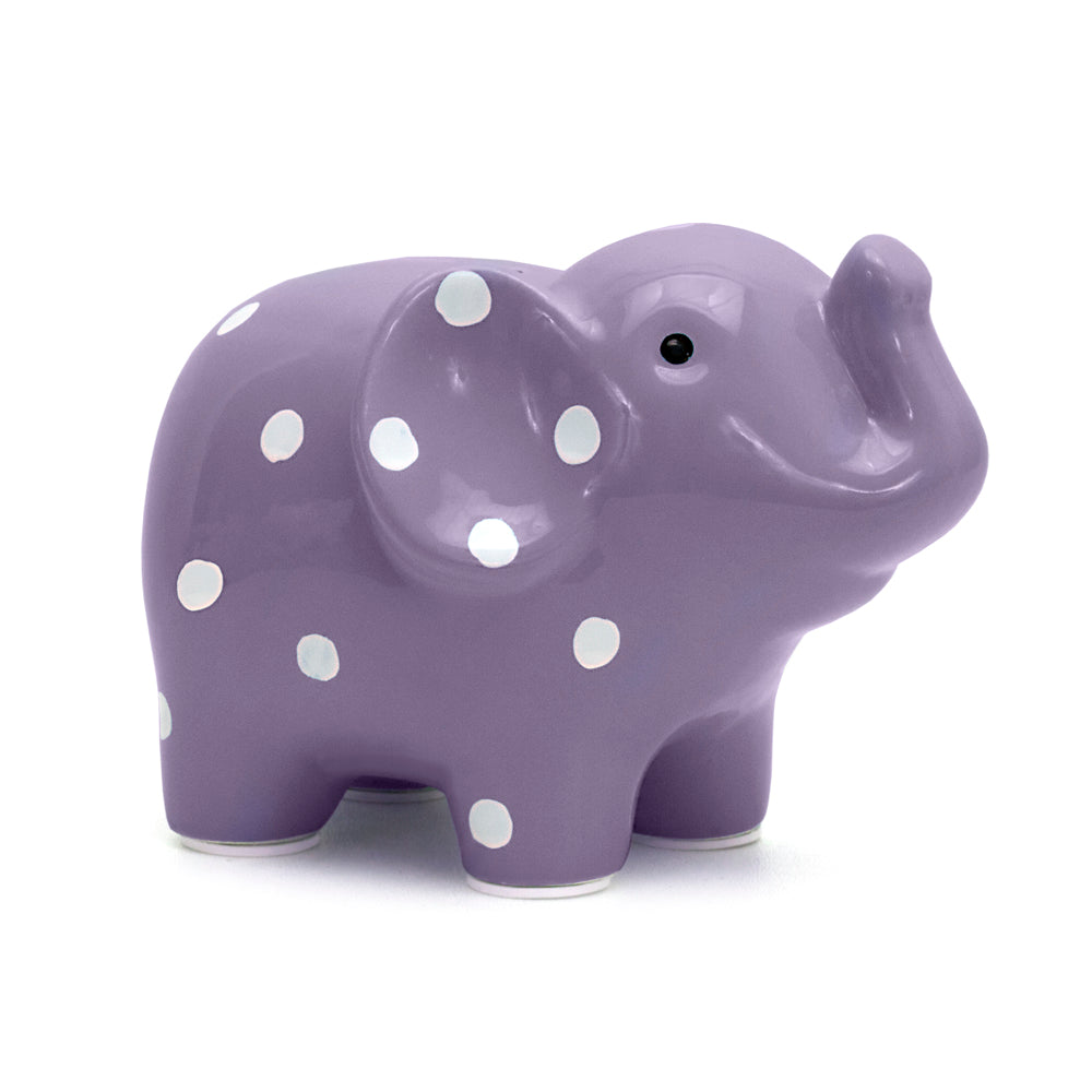 Medium lavender ceramic elephant piggy bank with white polka dots, side view