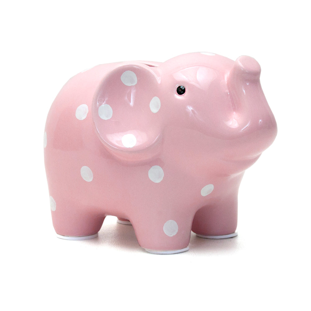 Medium-sized pink elephant piggy bank with white polka dots and raised trunk
