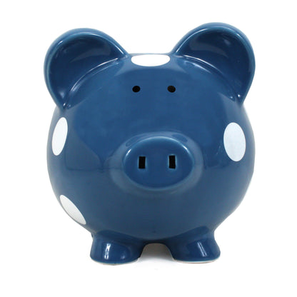 Front-facing close-up of dark blue piggy bank with white polka dots and coin slot