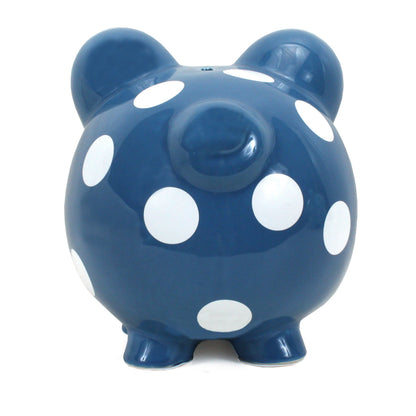 Front view of dark blue polka dot piggy bank with coin slot on top