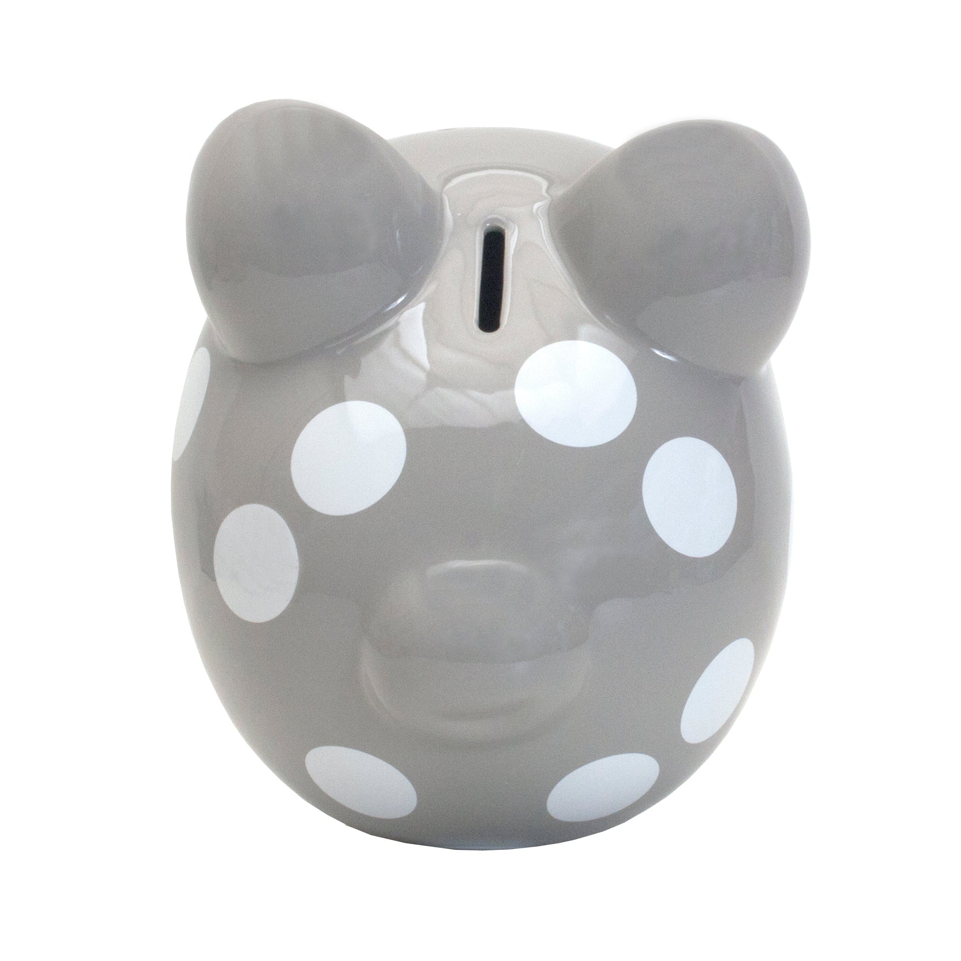 Top view of gray ceramic piggy bank with white polka dots and coin slot