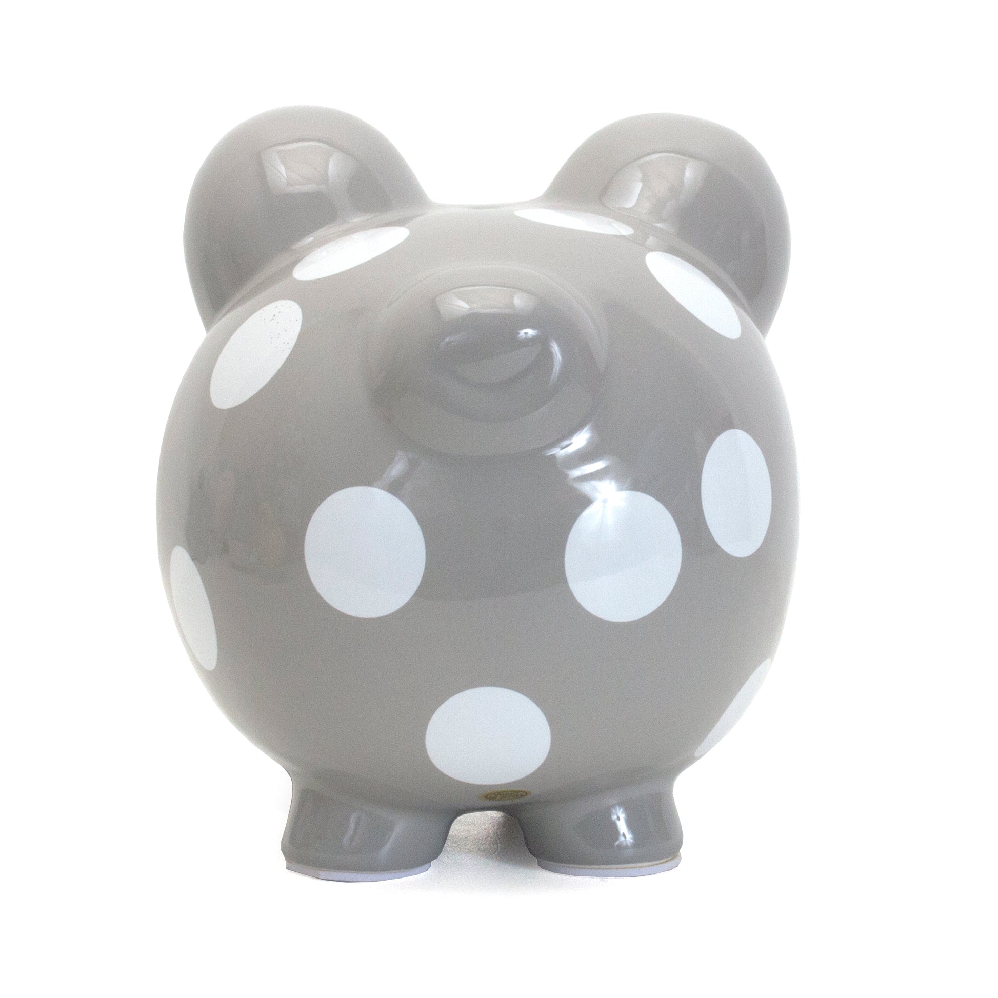 Round gray piggy bank with white polka dots front view showing snout and eyes