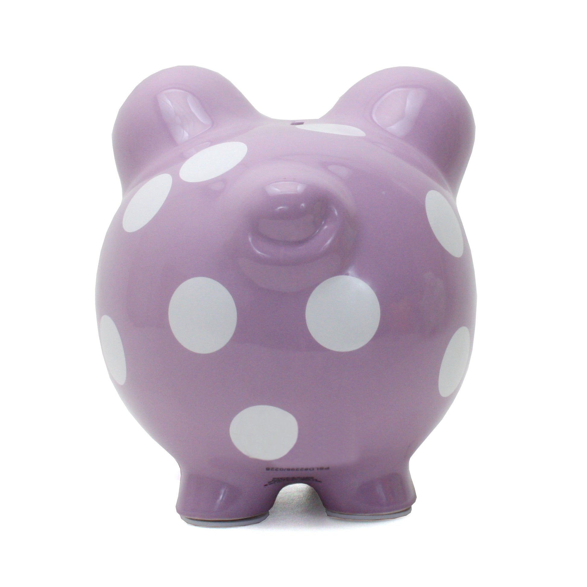 Back view of purple polka dot piggy bank showing coin slot