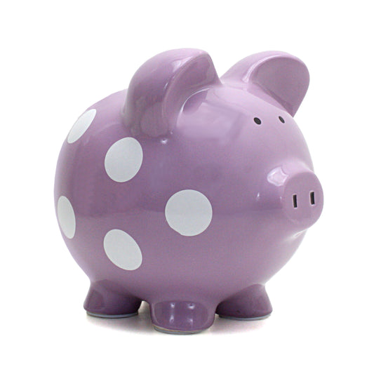 Purple ceramic piggy bank with white polka dots front angled view