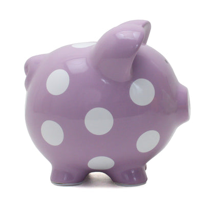 Side view of purple ceramic piggy bank with white polka dots
