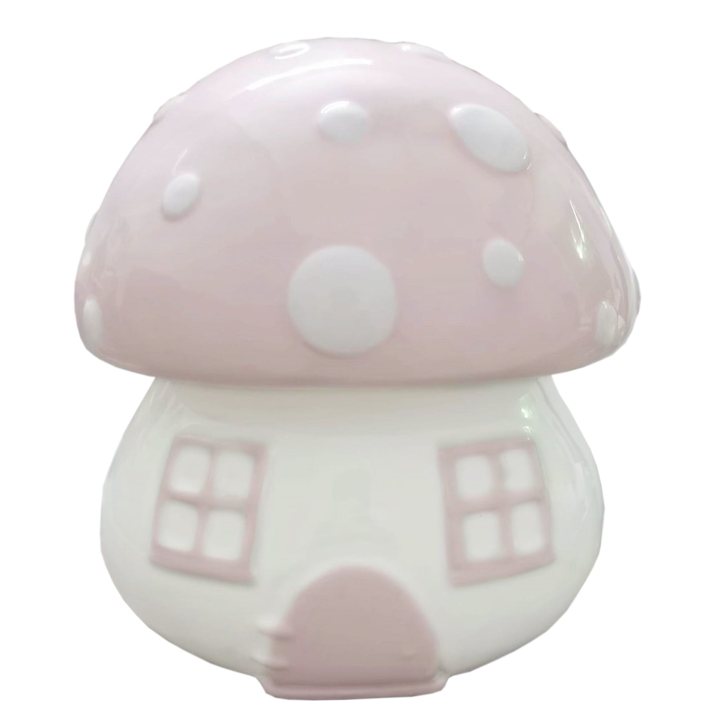 Front view of pink mushroom shaped ceramic piggy bank with white polka dots and window details