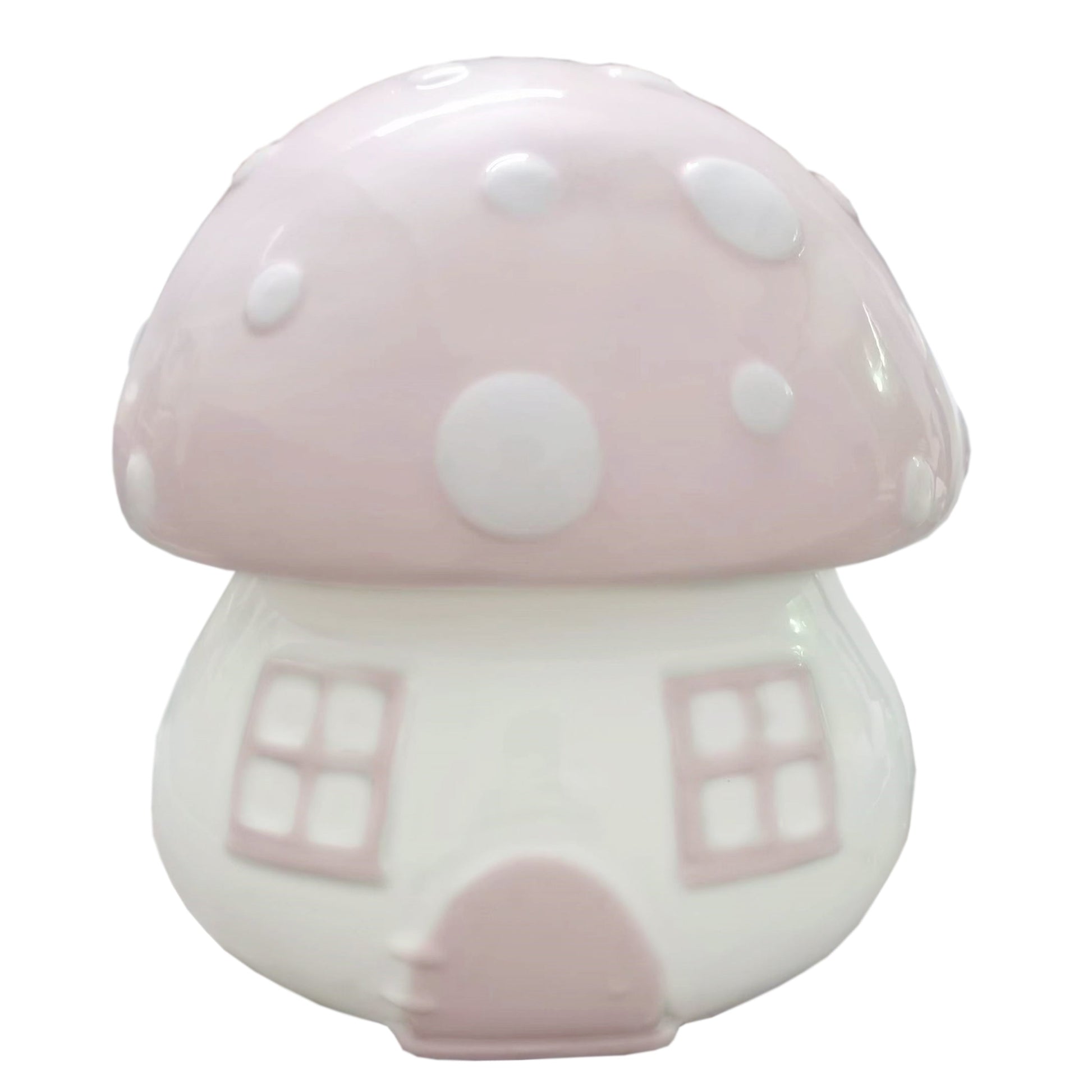 Front view of pink mushroom shaped ceramic piggy bank with white polka dots and window details
